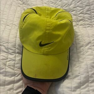 Nike Bright Yellow Cap with Black Accents has a stain from makeup on top
